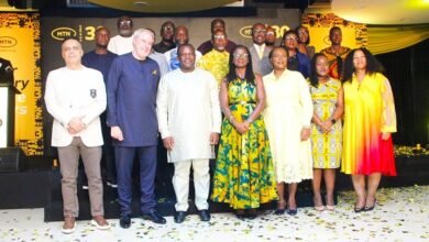 -Mr George (third from left, front row), with Mr Blewett (second from left) and MTN senior management members