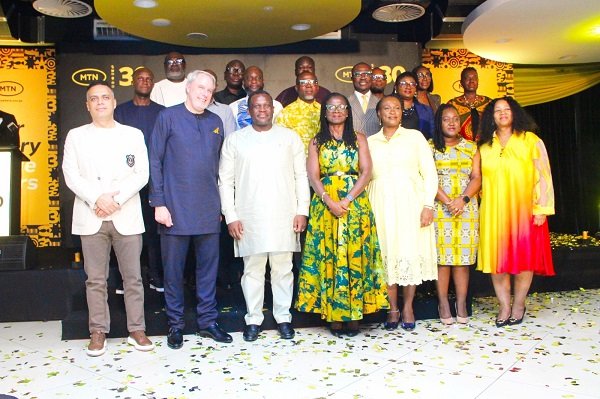 -Mr George (third from left, front row), with Mr Blewett (second from left) and MTN senior management members