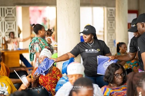 Madam Appau-Klu (middle) distributing parcels to beneficiaries at the gathering
