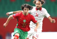 Morocco's Ibrahim Rabbaj comes under a challenges from Tunisian Yahya Jlidi during the game