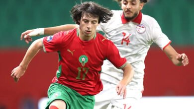 Morocco's Ibrahim Rabbaj comes under a challenges from Tunisian Yahya Jlidi during the game