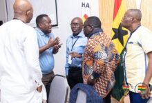 Mr Akpokavie (arrowed) in a discussion with members of the GOC Executive Board