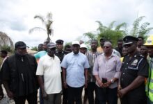 Mr Buah (middle) and some officials at the ceremony