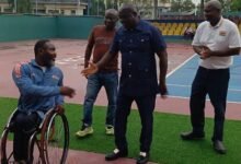 • Mr K. Appiah interacts with a para athlete while Mr Amofa (right) and Mr Chartey Annan, an official look on