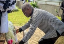 Mr Kofi Adams lays a wreath to commemorate the Silver Jubilee of the May 9 tragedy