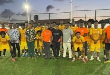 Mr Nkoo Joseph (arrowed) with players and officials of Attram De Visser FC