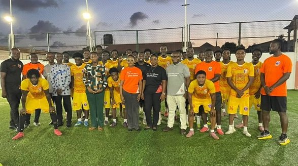 Mr Nkoo Joseph (arrowed) with players and officials of Attram De Visser FC