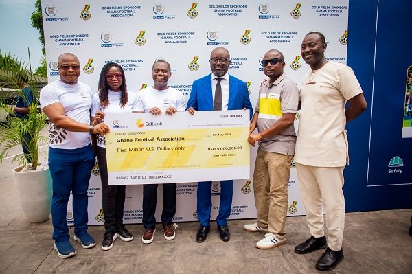 Mr Simeone-Okraku (third right) with Mr Elliot Twum (third lleft) and other officials display the dummy cheque