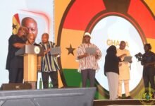 President Mahama (left) and some ministers of state trying their hands on the e-Visa Portal platform