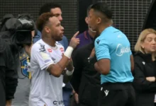 Neymar(left) protesting a referee decision during the game