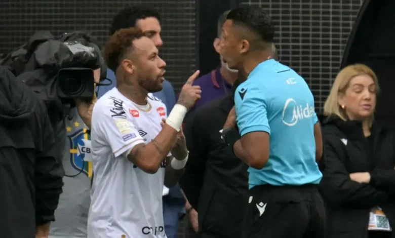 Neymar(left) protesting a referee decision during the game