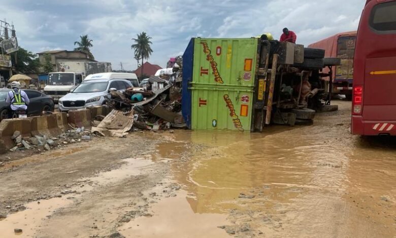 • A deplorable section of the road near the Amasaman flyover, where a vehicle overturned last week