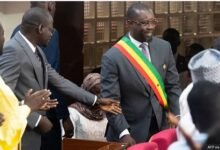 Ousmane Sonko, seen here wearing his sash in parliament