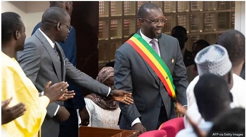Ousmane Sonko, seen here wearing his sash in parliament