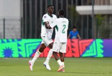 Players of Senegal celebrating a goal against Algeria