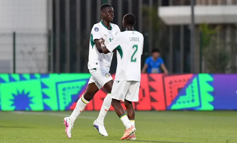 Players of Senegal celebrating a goal against Algeria