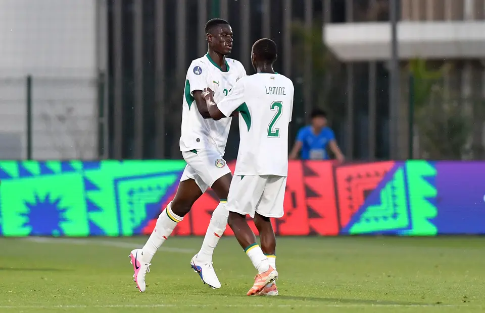 Players of Senegal celebrating a goal against Algeria