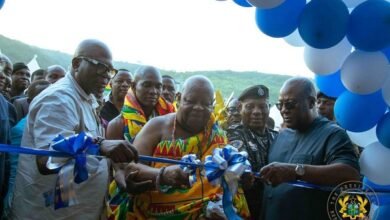 President Mahama (right), assisting Nene Sakite II (middle) to cut the tape to commission the facility