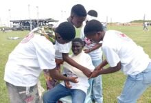Participants showcasing a life saving technique at the event