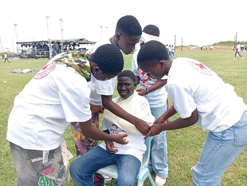 Participants showcasing a life saving technique at the event