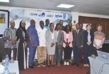 Mr Asante-Twum (fourth from left) with Ms Anti (sixth from right) and other participants during the stakeholders dialoque. ,