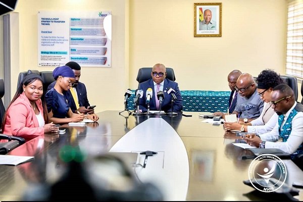 Dr Bampoe (head of table) addressing the press conference