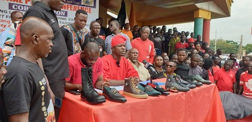 Mr Ntim(in red smoke) addressing the press