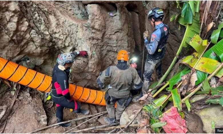 Some of the rescuers at the entrance of the flooded Laos cave