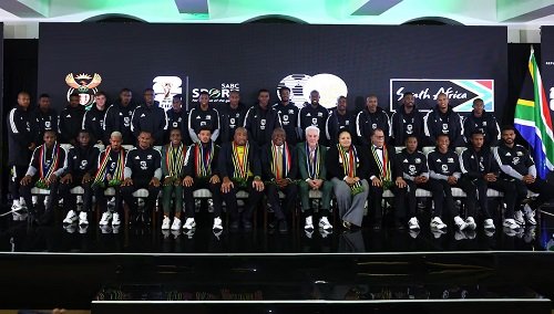 South Africa president Cyril Ramaphosa, coach Hugo Broos with the squad and other officals after the announcement