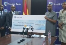 Mr Asomaning (second from left), presenting the dummy cheque to Mr Ampem