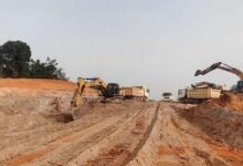 Earth moving machines working on the Enchi–Elubo road project