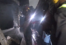 Personnel from the Ghana National Fire Service putting out the fire