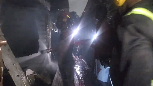 Personnel from the Ghana National Fire Service putting out the fire