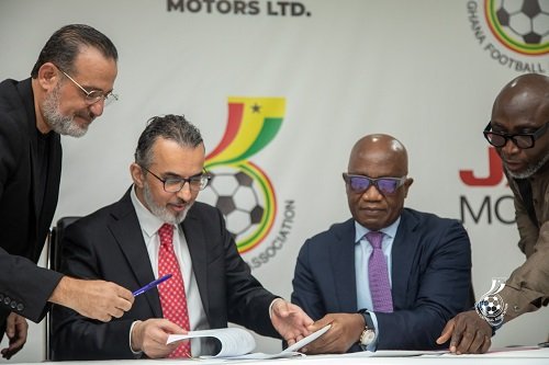 Mr Hijazi and Mr Addo (both seated) signing the documents while Mr Fattal and GFA General Secretary, Mr Prosper Harrison Addo, look on