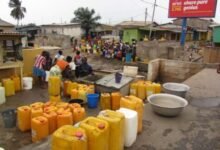 • Residents queue with gallons to get water