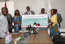 Prof. Adanu [middle] presenting the dummy cheque to Ms Darko -Opoku [fourth from left]. With them are officials from Trust Fund and Ghana College of Physicians. Photo Elizabeth Okai