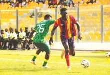 • Hearts of Oak defender Baba Adamu tries to go past Daniel Kwame Awun
