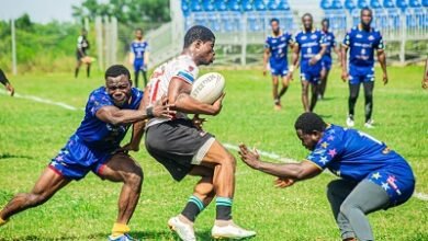 Skolars Illyassu Musbawu (white) meandering his way through a tackle two Tigers players 
