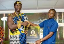 Mr Donkor (right) one of the awardees receiving a citation at the awards ceremony