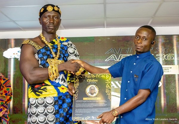 Mr Donkor (right) one of the awardees receiving a citation at the awards ceremony