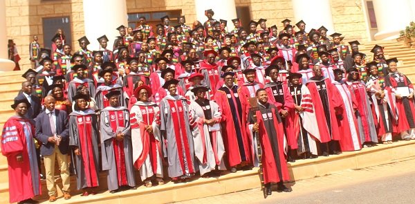 Mr Avle (seventh from right, front row) with faculty members and graduates after the graduation ceremony. Photo Ebo Gorman