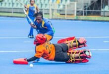 Army player Konadu Jennifer tries to outwit Reformers' goalkeeper Beatrice Antwi during their game