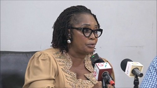 Ms Rita Akosua Awatey (inset) addressing the gathering during the meeting