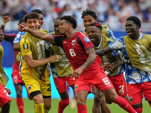 Cape Verde players join Kevin Pina (6) to celebrate his goal against Uruguay