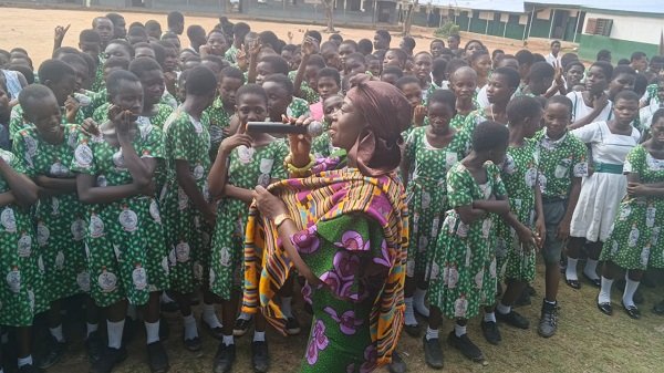 Nana Mozu addressing students at Apremdo Catholic School.