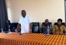 Mr Gunu (inset) addressing the residents