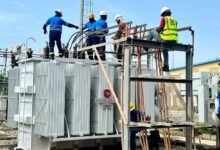 Some ECG engineers and technicians installing the new power transformer