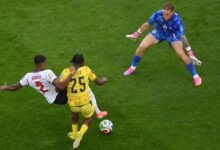 Enzri Konsa involved in the tackle that attracted shouts of a penalty against ngland