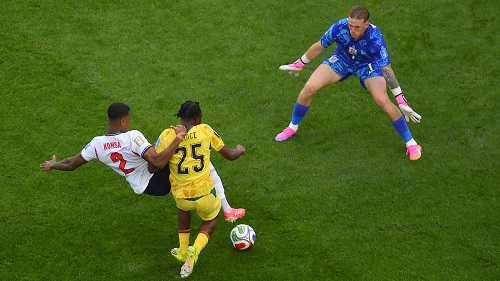 Enzri Konsa involved in the tackle that attracted shouts of a penalty against ngland