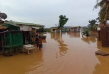 Floodwaters submerge a provision store and houses at Oduman, Accra. Photo. Ebo Gorman